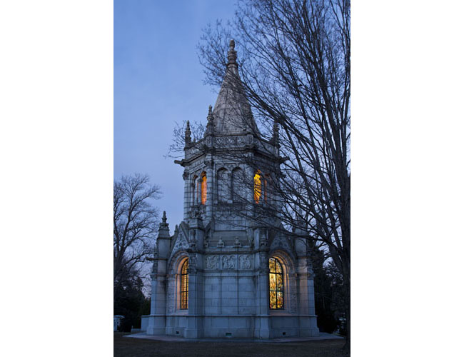 A view of Harbeck mausoleum illuminated at night. Photograph by Gavin Ashworth. Herbeck Mausoleum