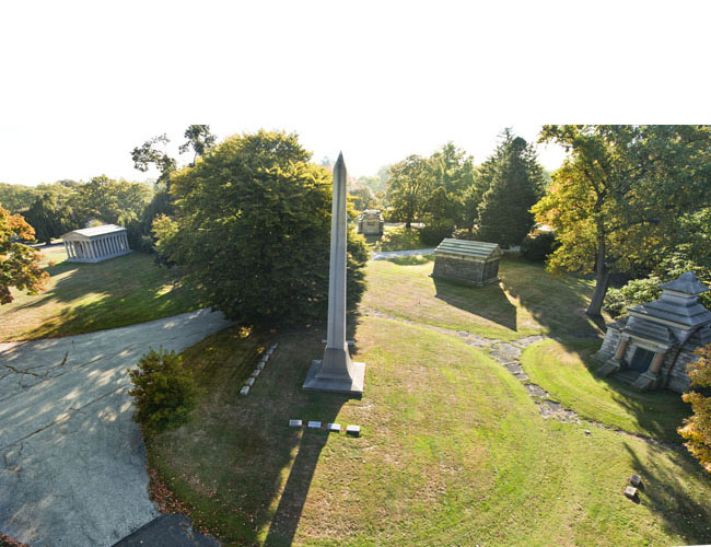 Large circles in Hawthorn and Lakeview Plots with the William Hall obelisk in the foreground and the Jay Gould mausoleum in the distance at left. Gould's is the largest circular lot at Woodlawn. Photograph by Gavin Ashworth. Woodlawn Circular Plots