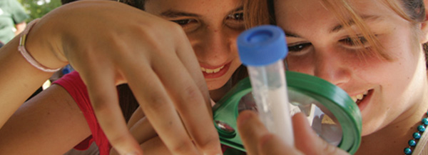 Two high school students enjoy a science experiment at the Lamont-Doherty Earth Observatory&rsquo;s annual fall Open House.